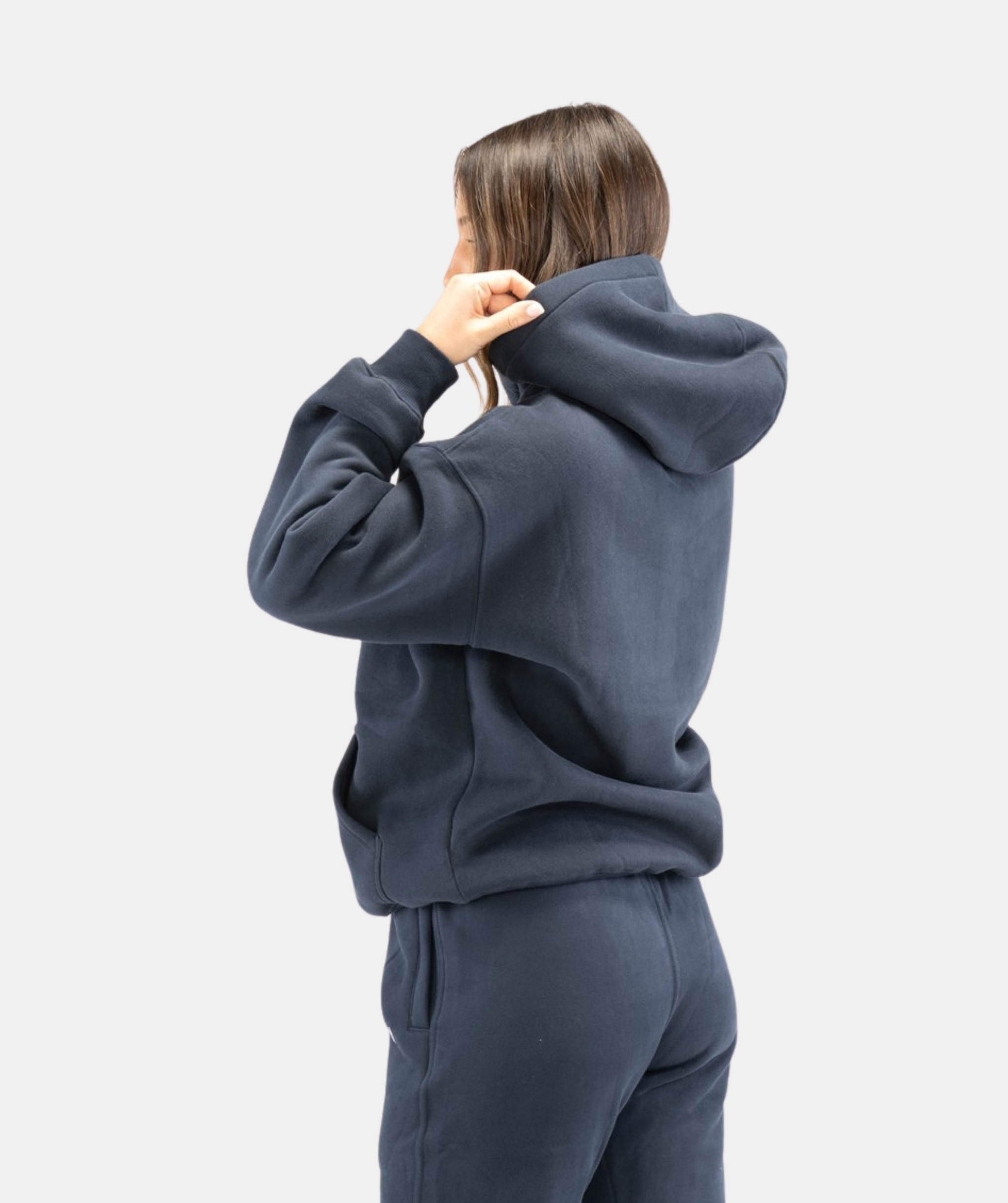 Rear view of women’s navy blue hoodie showing hood shape and smooth seam detailing