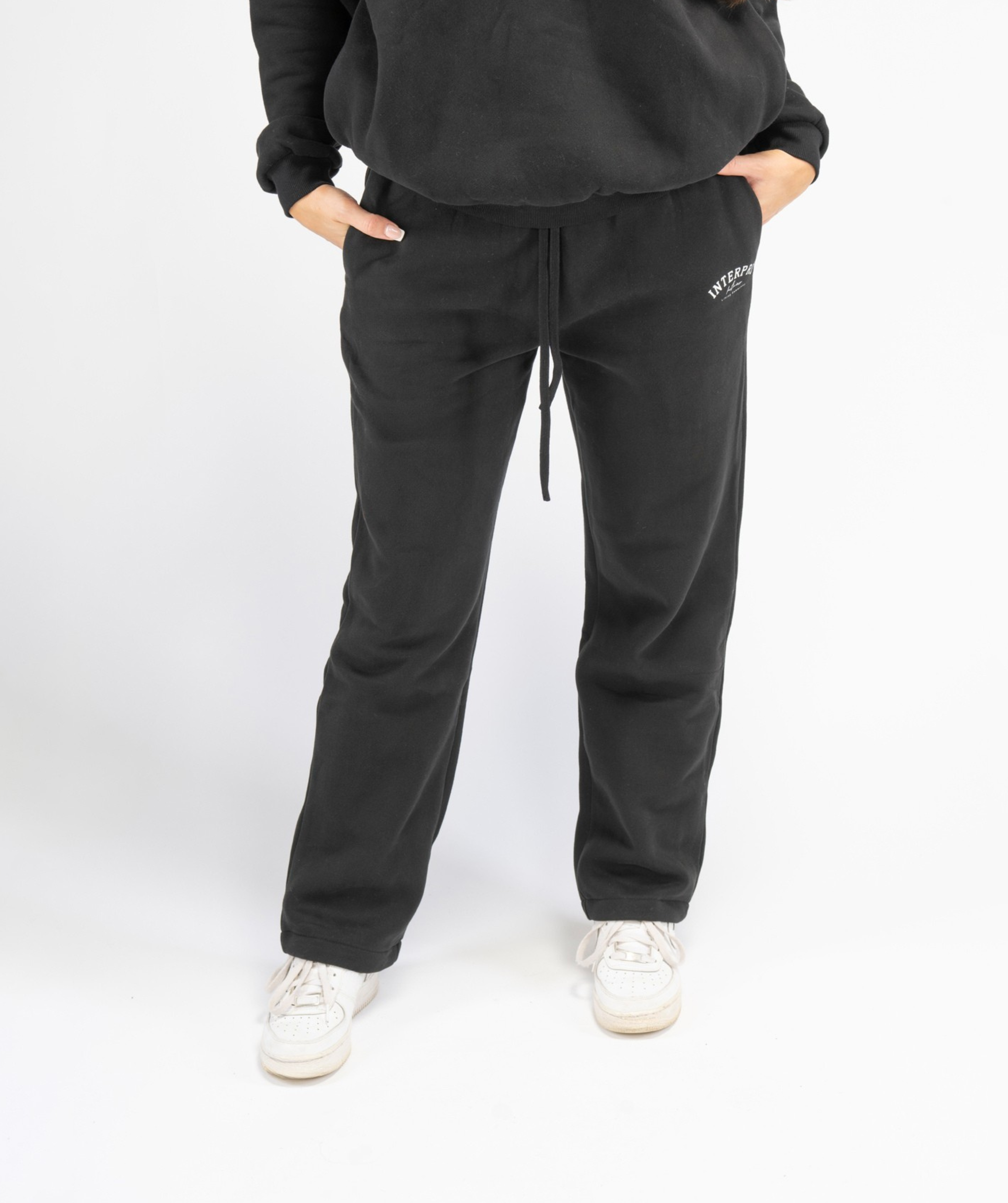 interpro fitness womens straight leg black joggers front view on model