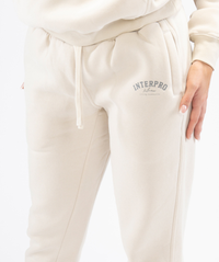 Close-up of cream Interpro Fitness joggers pocket and logo