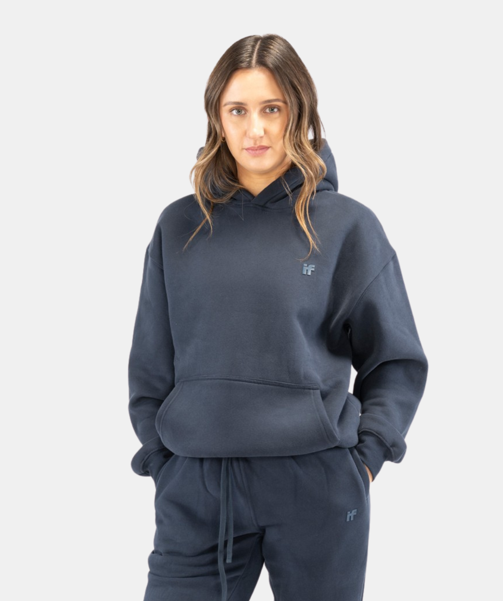 Front view of women’s Interpro Fitness navy blue hoodie showing relaxed fit and minimalist design