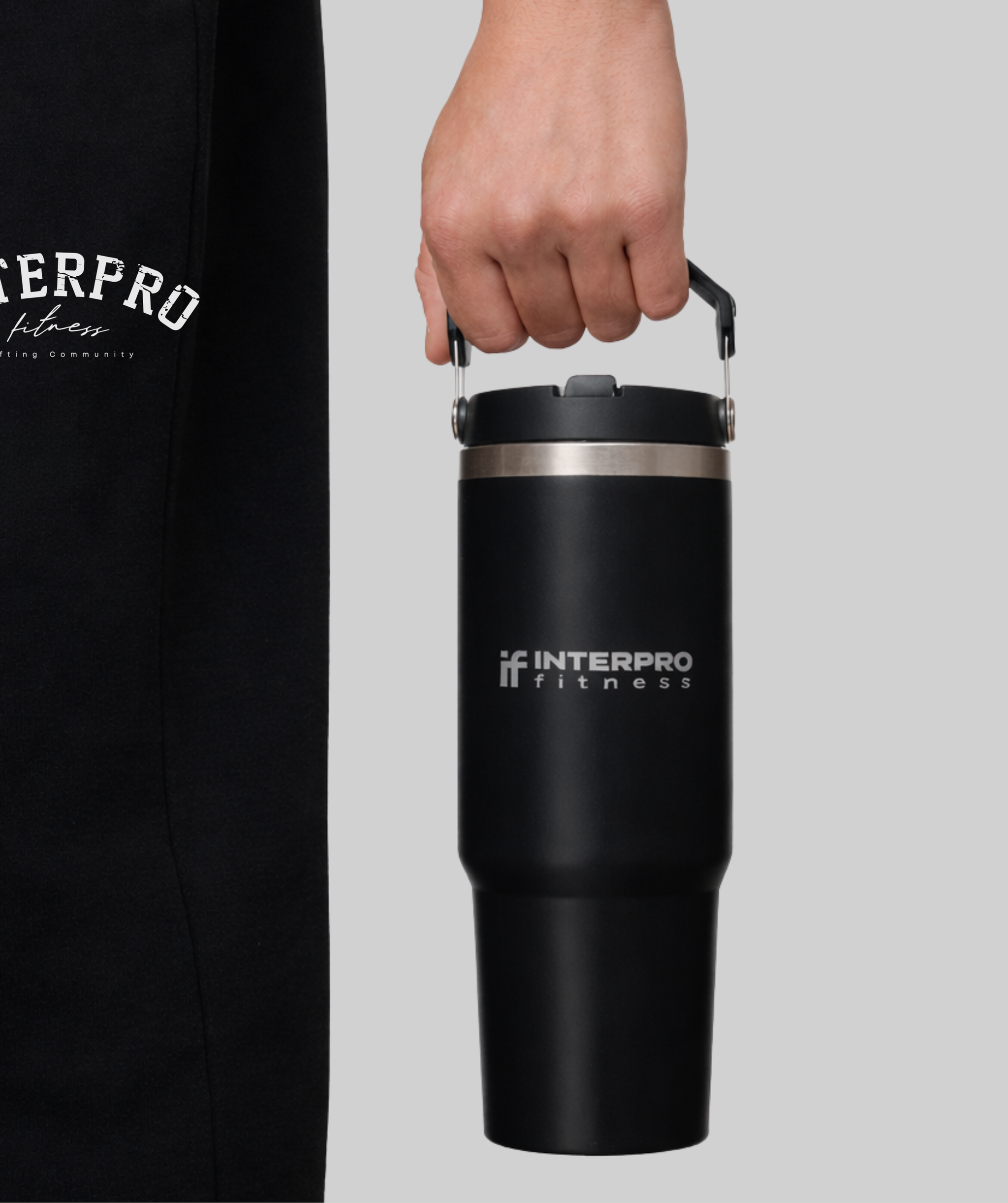 Interpro Fitness insulated flask for gym and everyday use. Person holding the flask