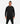 Man in black gym sweater front facing on white studio background
