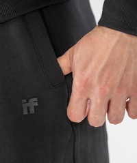 Close-up of pocket and stitching detail and silicone interpro logo on Interpro Fitness Men’s Black Regular Fit Gym Joggers.