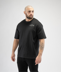 Black oversized men's gym T-shirt by Interpro Fitness, showcasing loose performance fit.