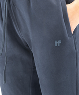 Side pocket close-up on navy Interpro Fitness joggers showing logo
