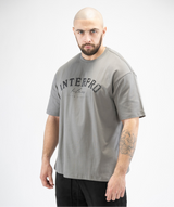 Grey oversized men’s gym tee, side angle showing large front Interpro logo