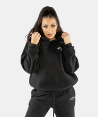 Front outfit featuring women’s black oversized hoodie styled with gymwear