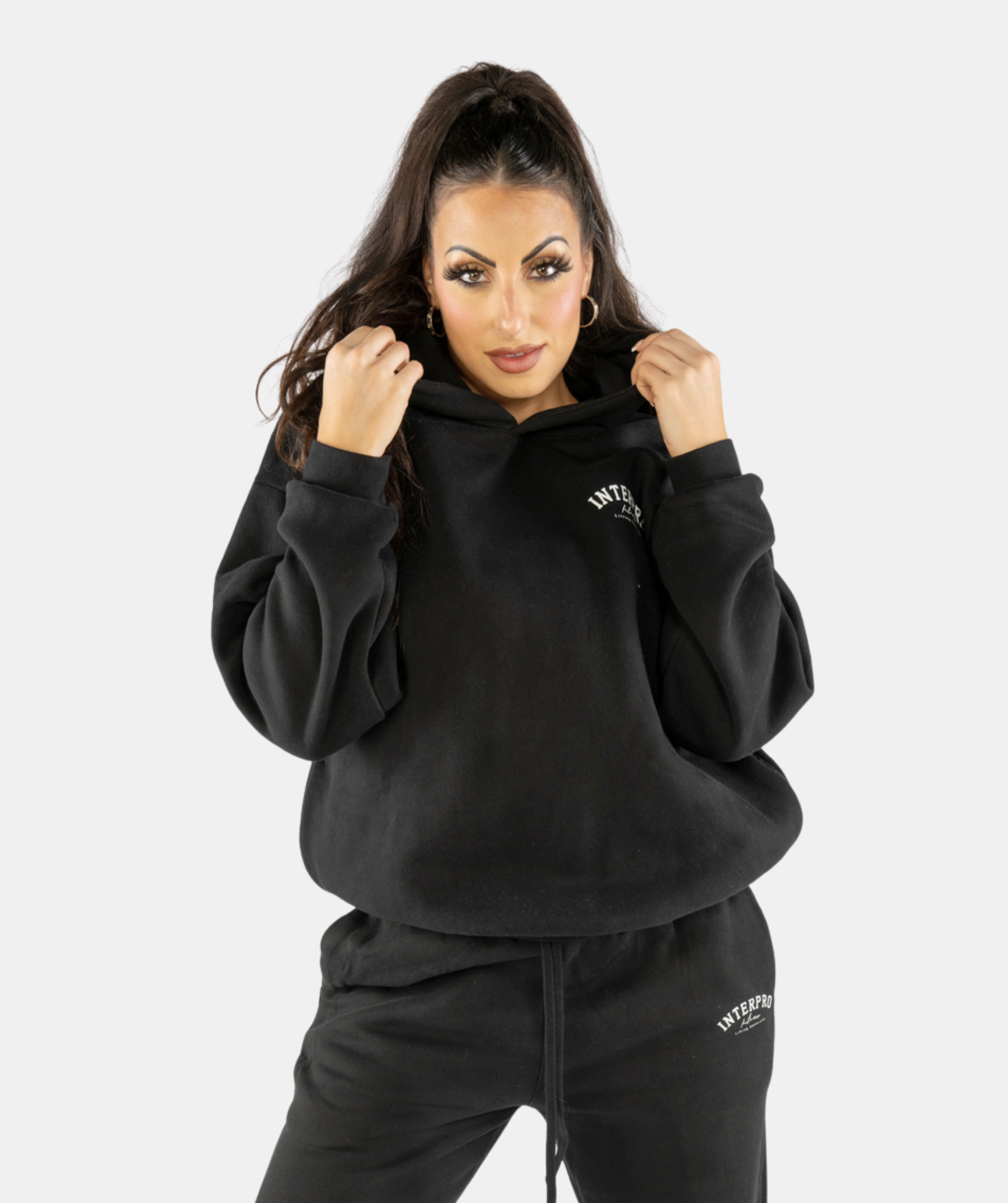 Front outfit featuring women’s black oversized hoodie styled with gymwear