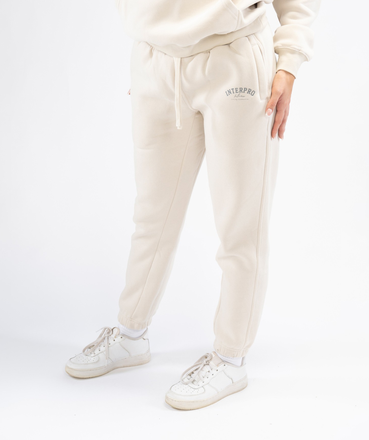 Interpro Fitness cream joggers showing tapered leg from the side
