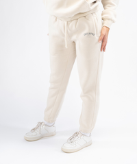 Interpro Fitness cream joggers showing tapered leg from the side