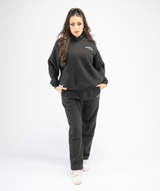 Front shot of women wearing black Interpro Fitness oversized hoodie showing comfort and style