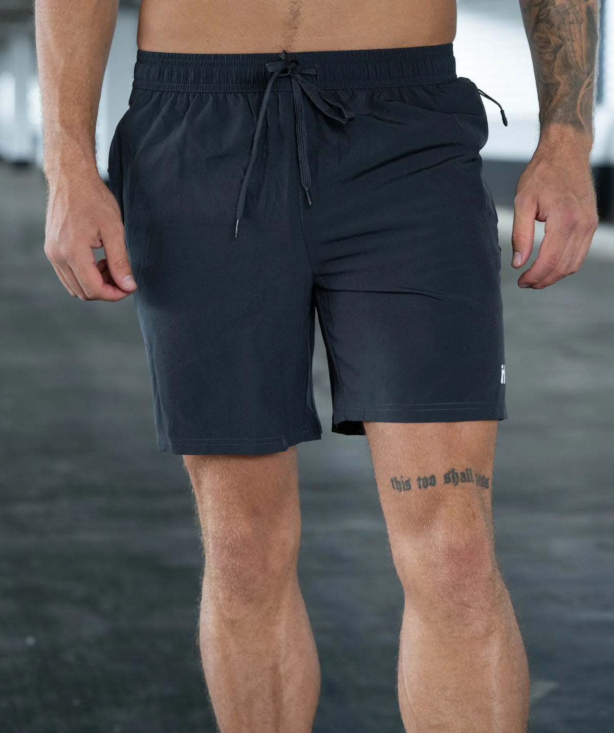 Person wearing black shorts 