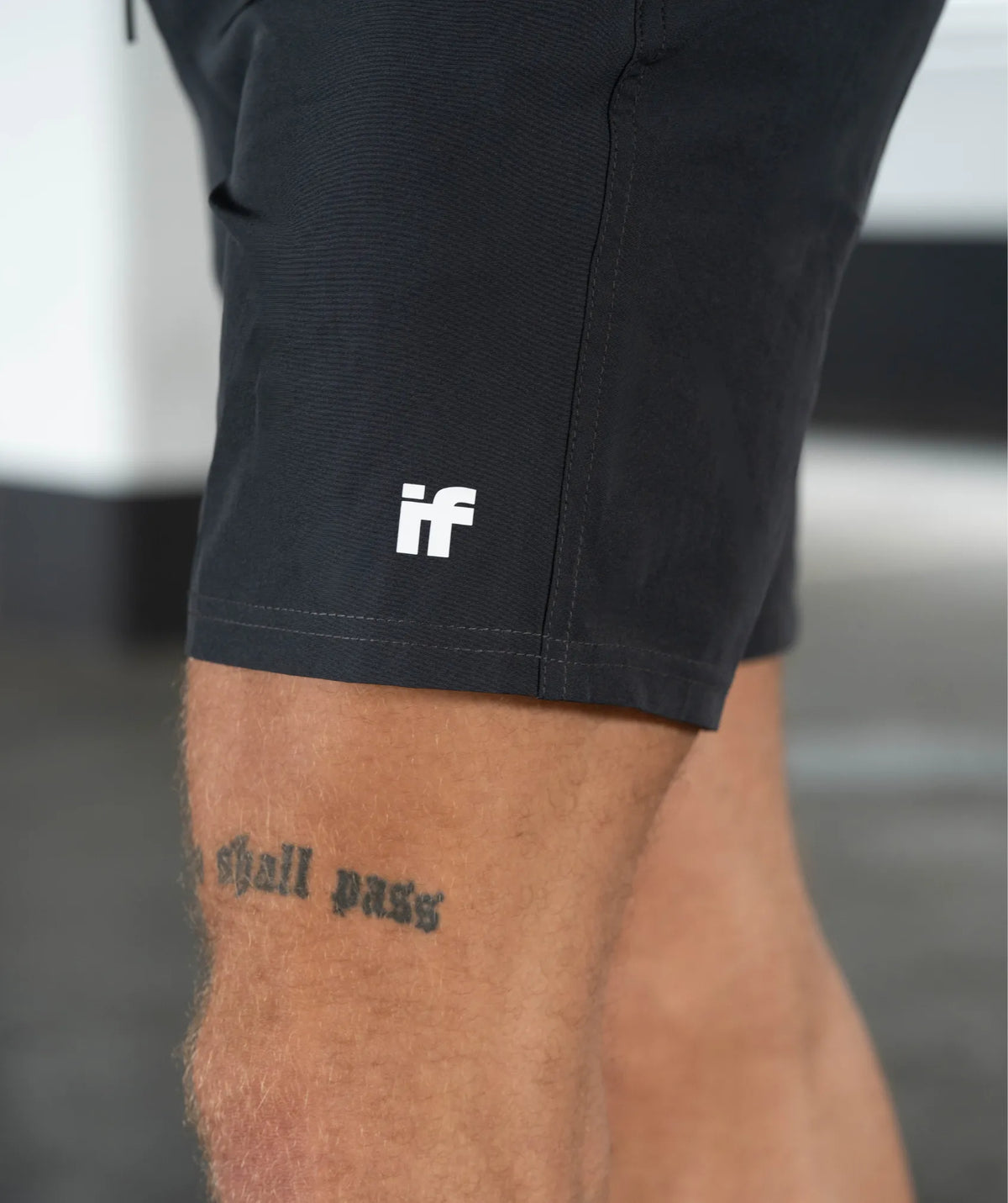 black shorts with a white logo 
