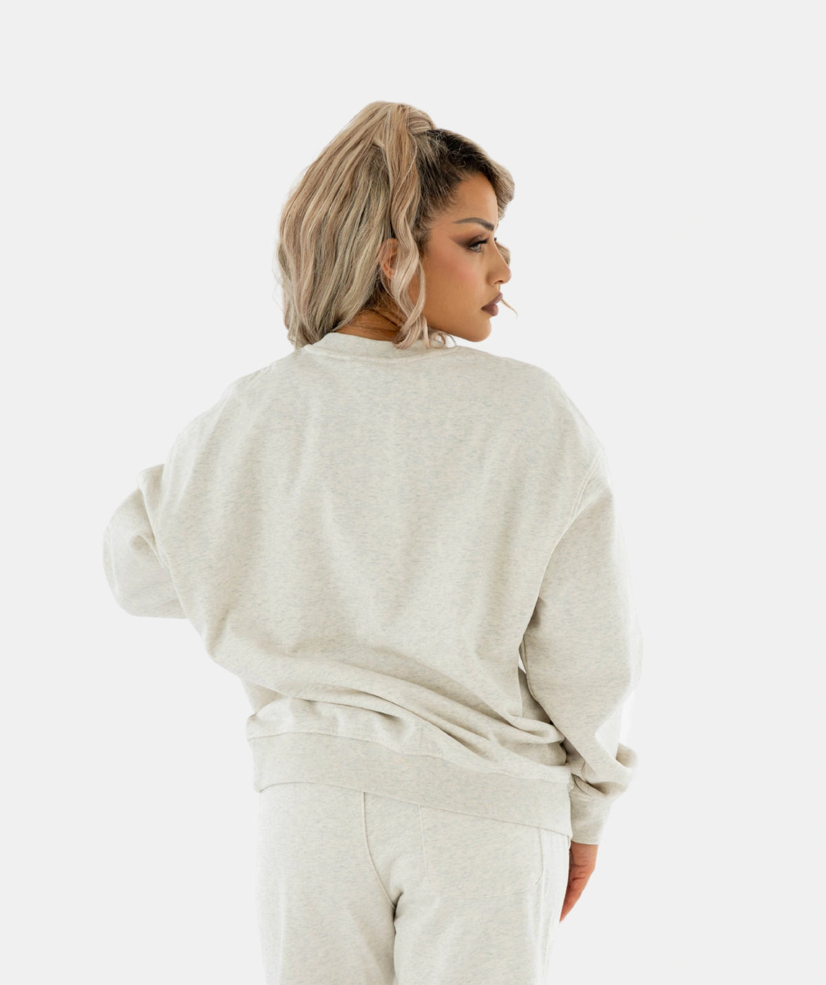 Woman wearing a beige sweater 
