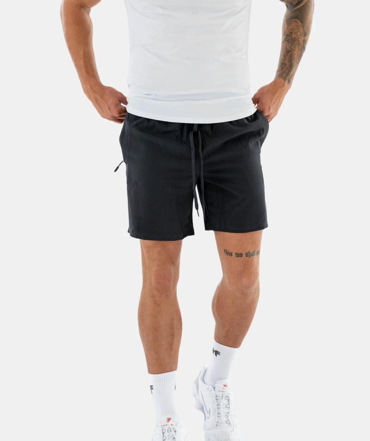 black shorts and white sneakers