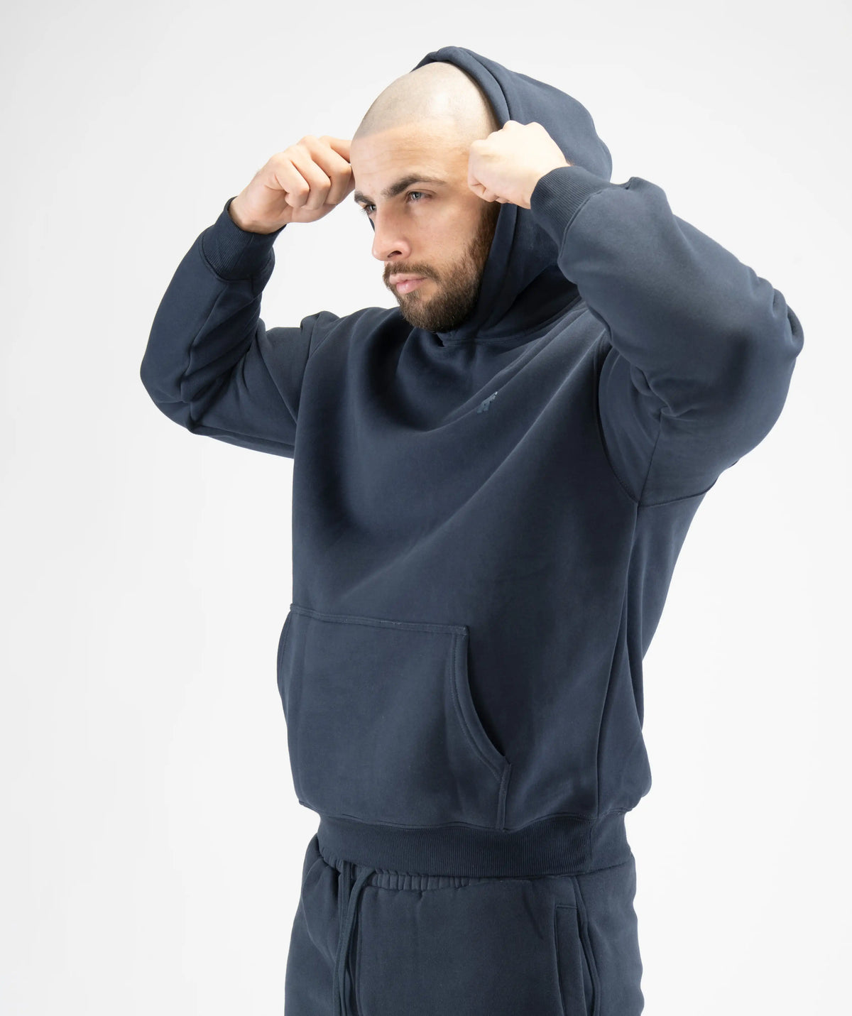 wearing a dark gray hoodie and pants 