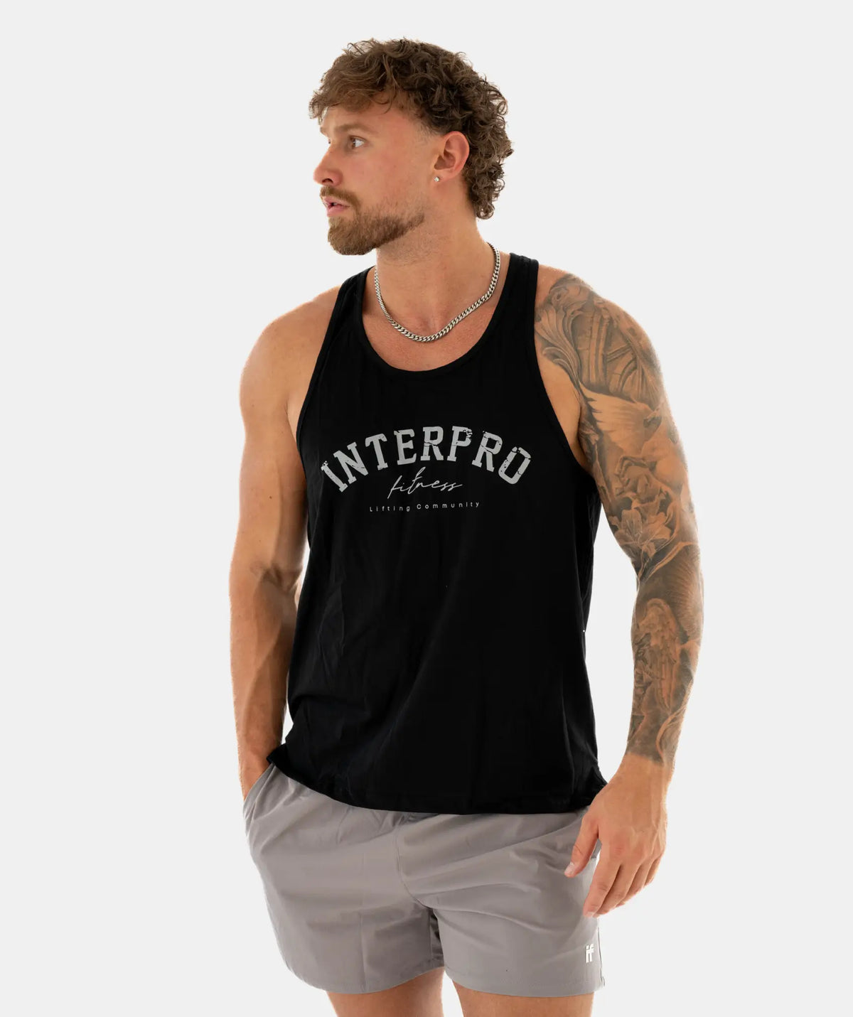 Man wearing a black tank top 