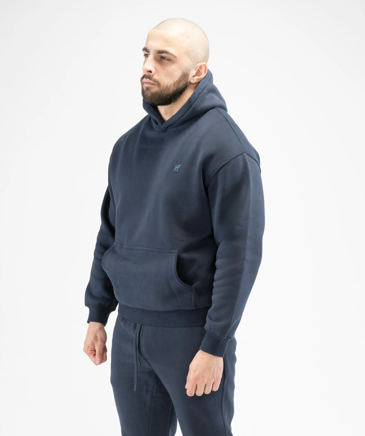 Man wearing a navy blue hoodie 