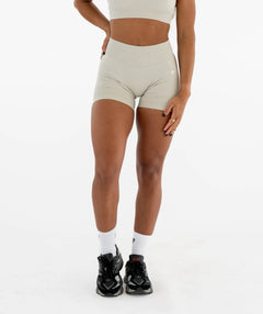 Person wearing beige athletic shorts 