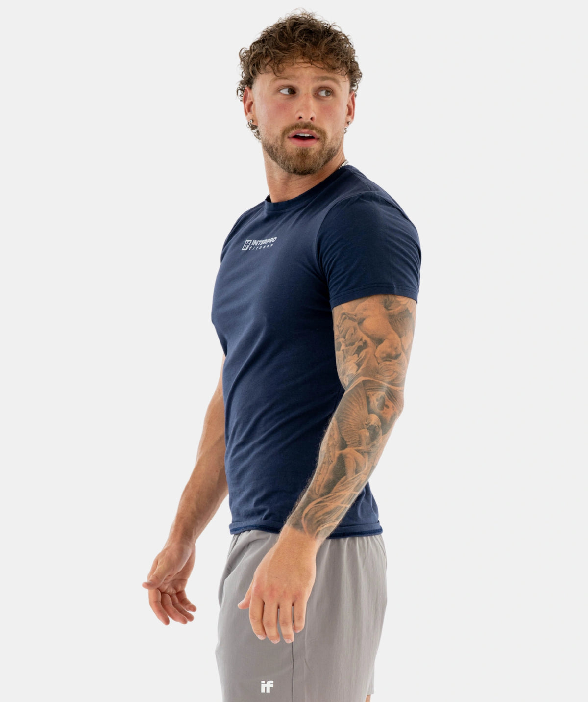 Man wearing a navy athletic shirt 