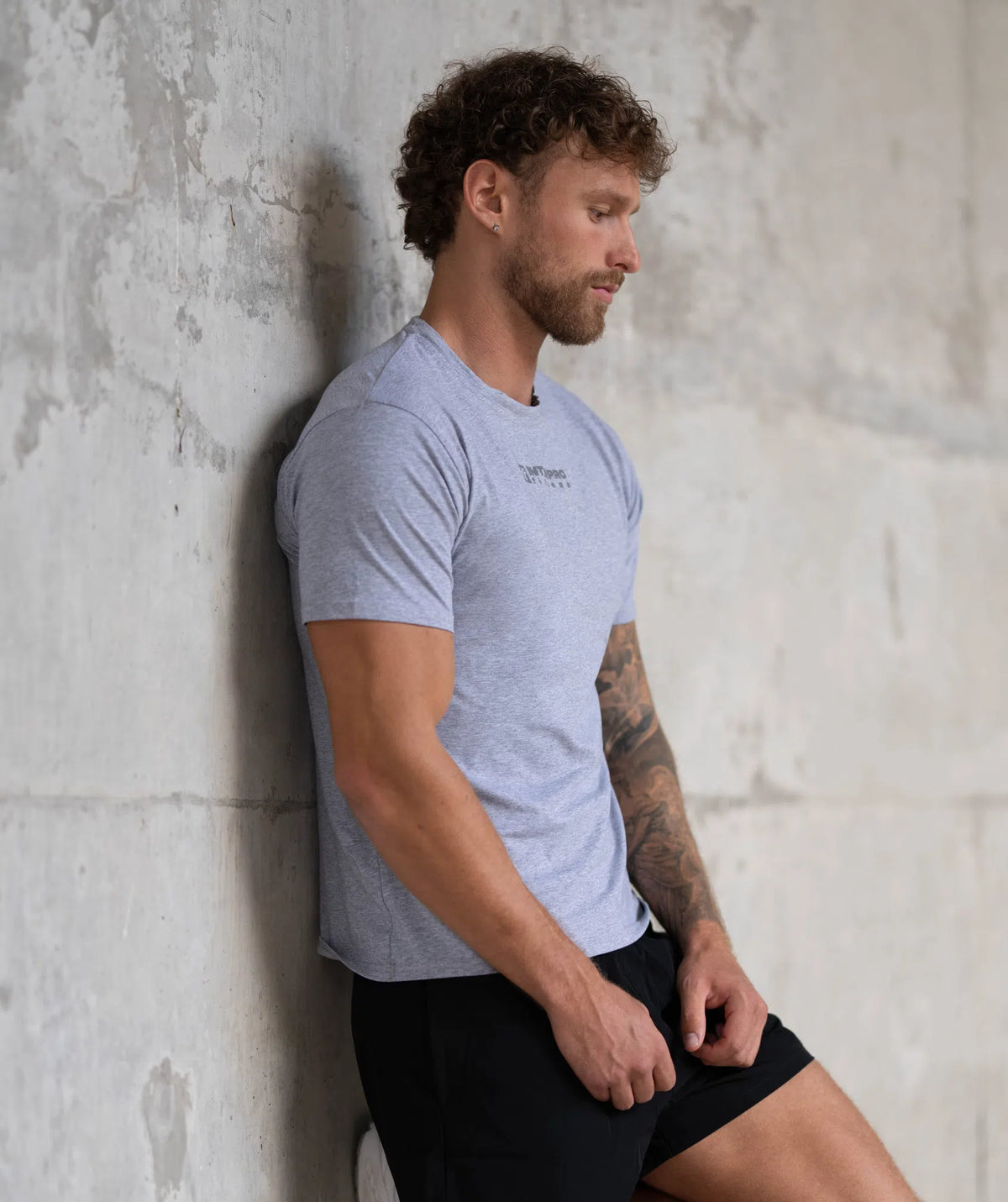 Man wearing a light blue t-shirt 