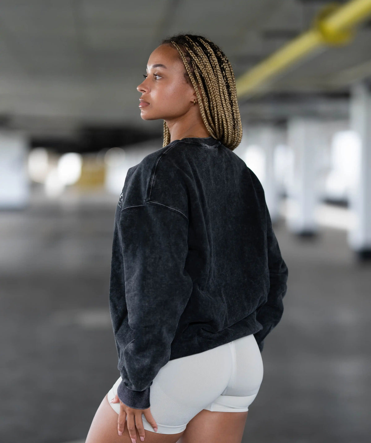 black sweatshirt and white shorts