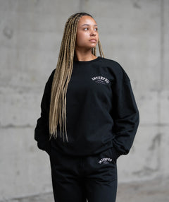 Women wearing a black sweatshirt