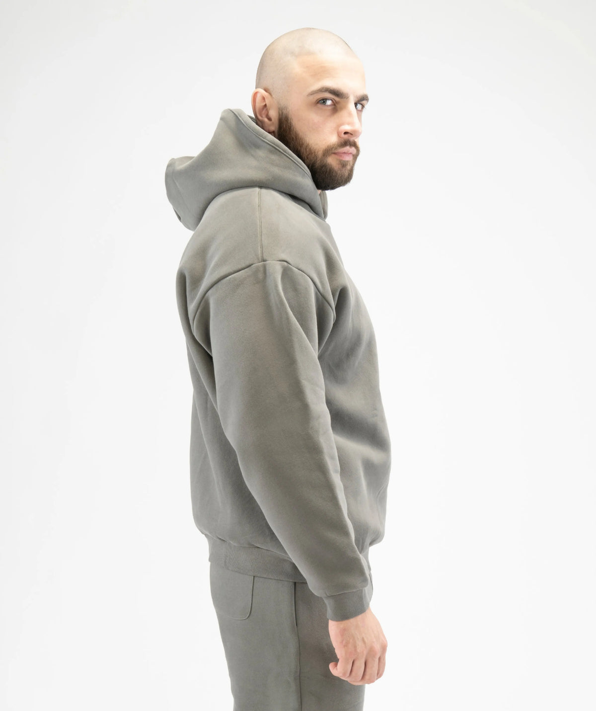 Man wearing a gray hoodie and pants 