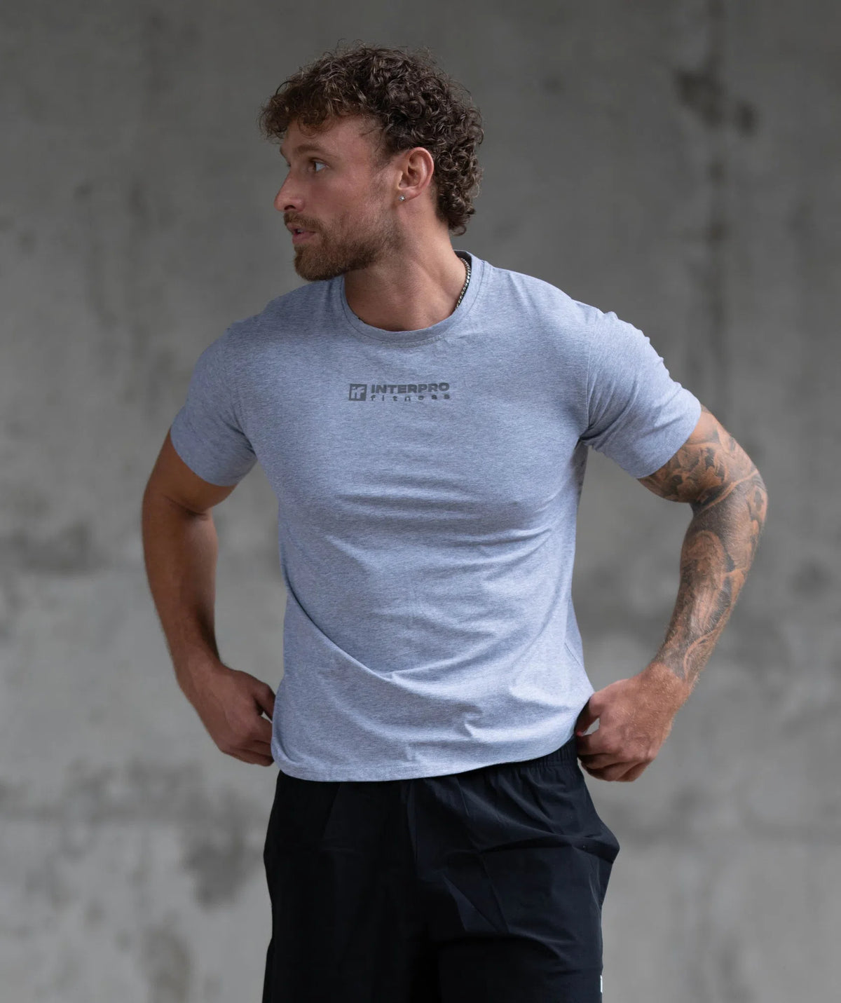 Man wearing a light blue t-shirt 