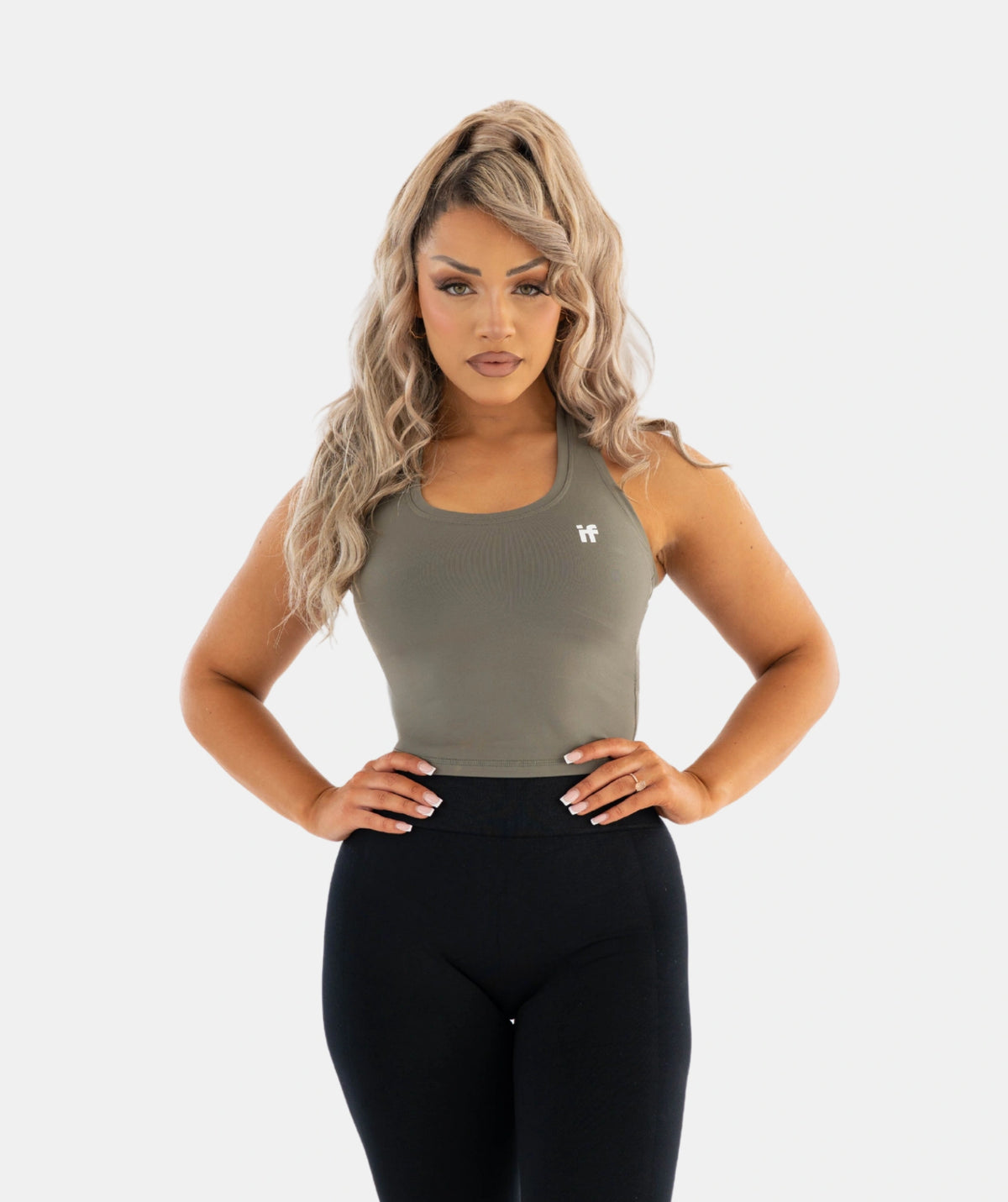 green tank top and black leggings