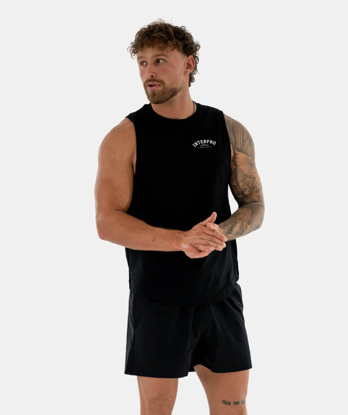 Man black sleeveless shirt shorts