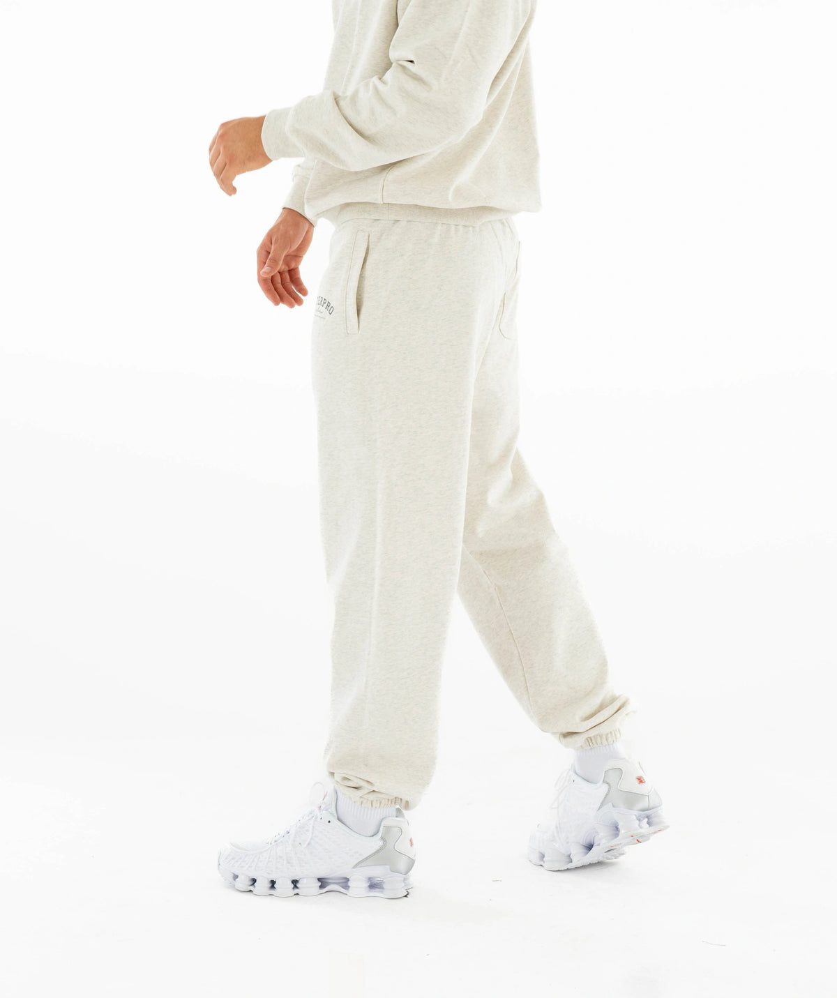 Person tracksuit, white sneakers 