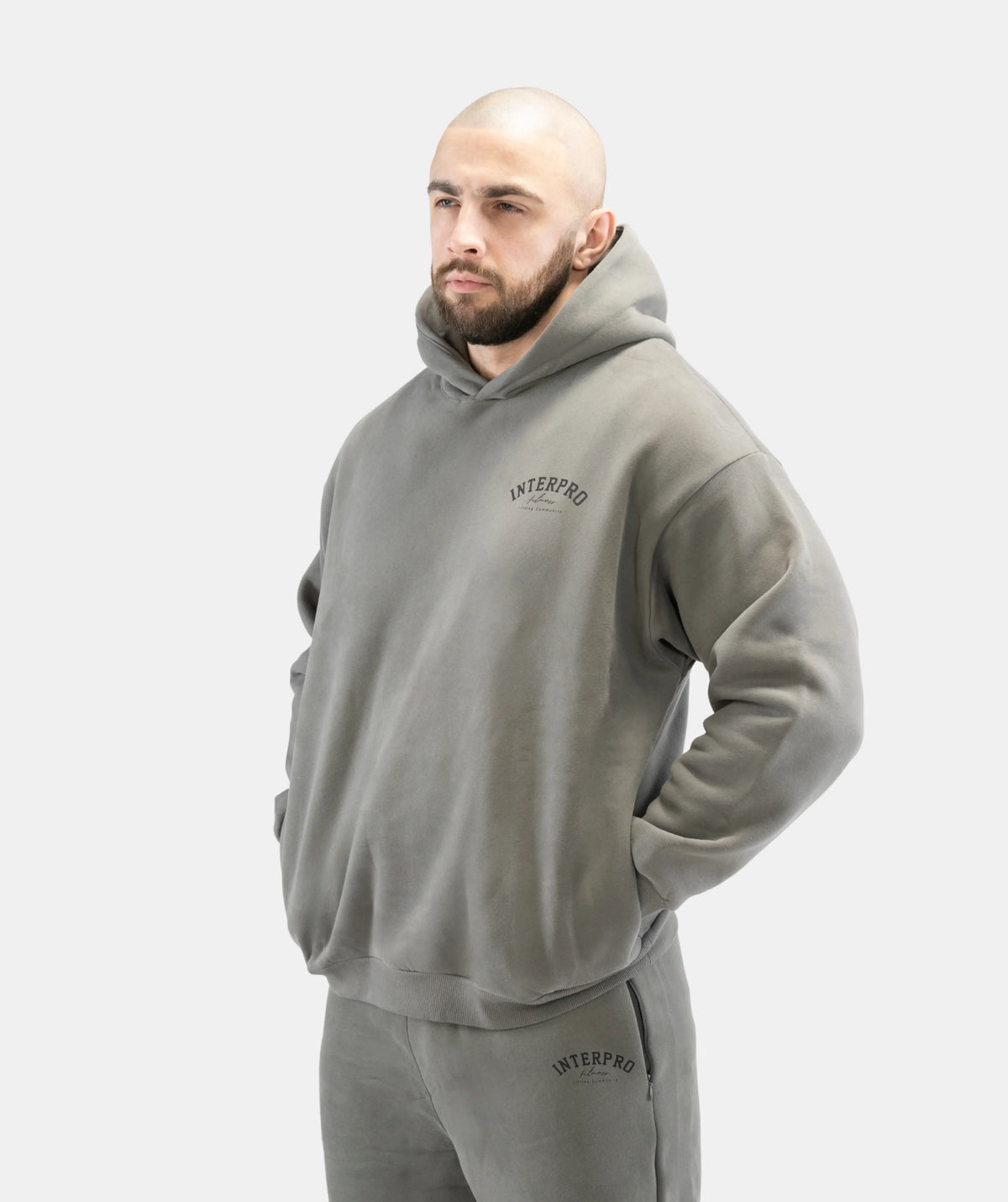 Man wearing a gray hoodie and pants 