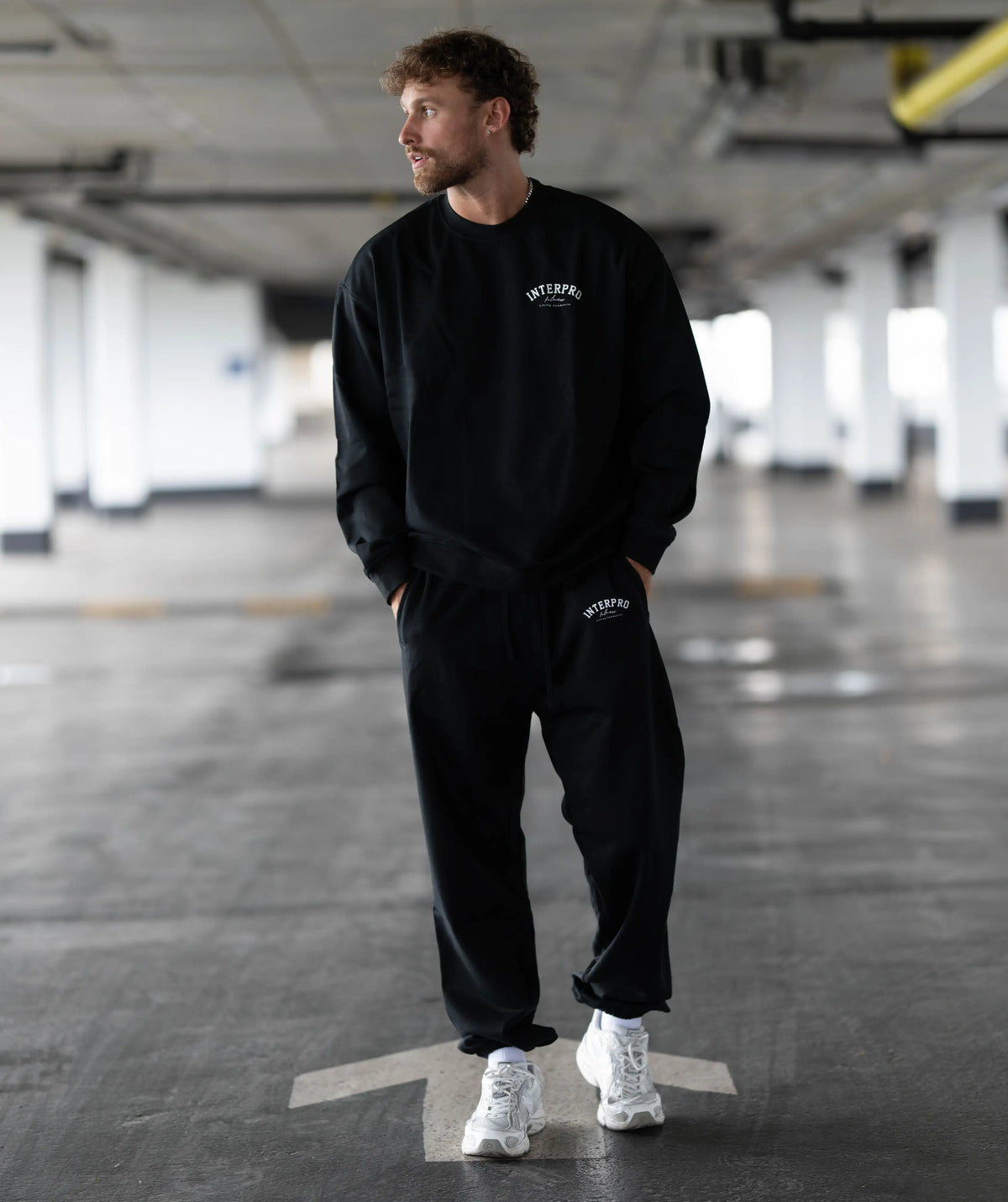 Man wearing a black tracksuit