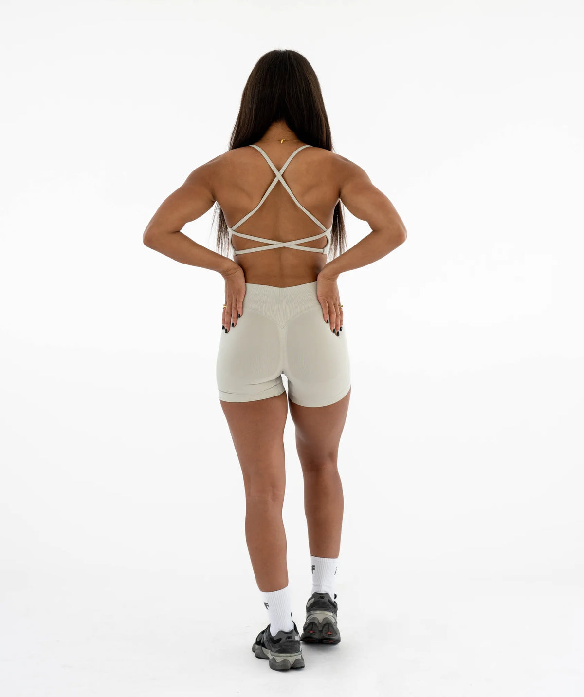 beige sports outfit with criss-cross straps