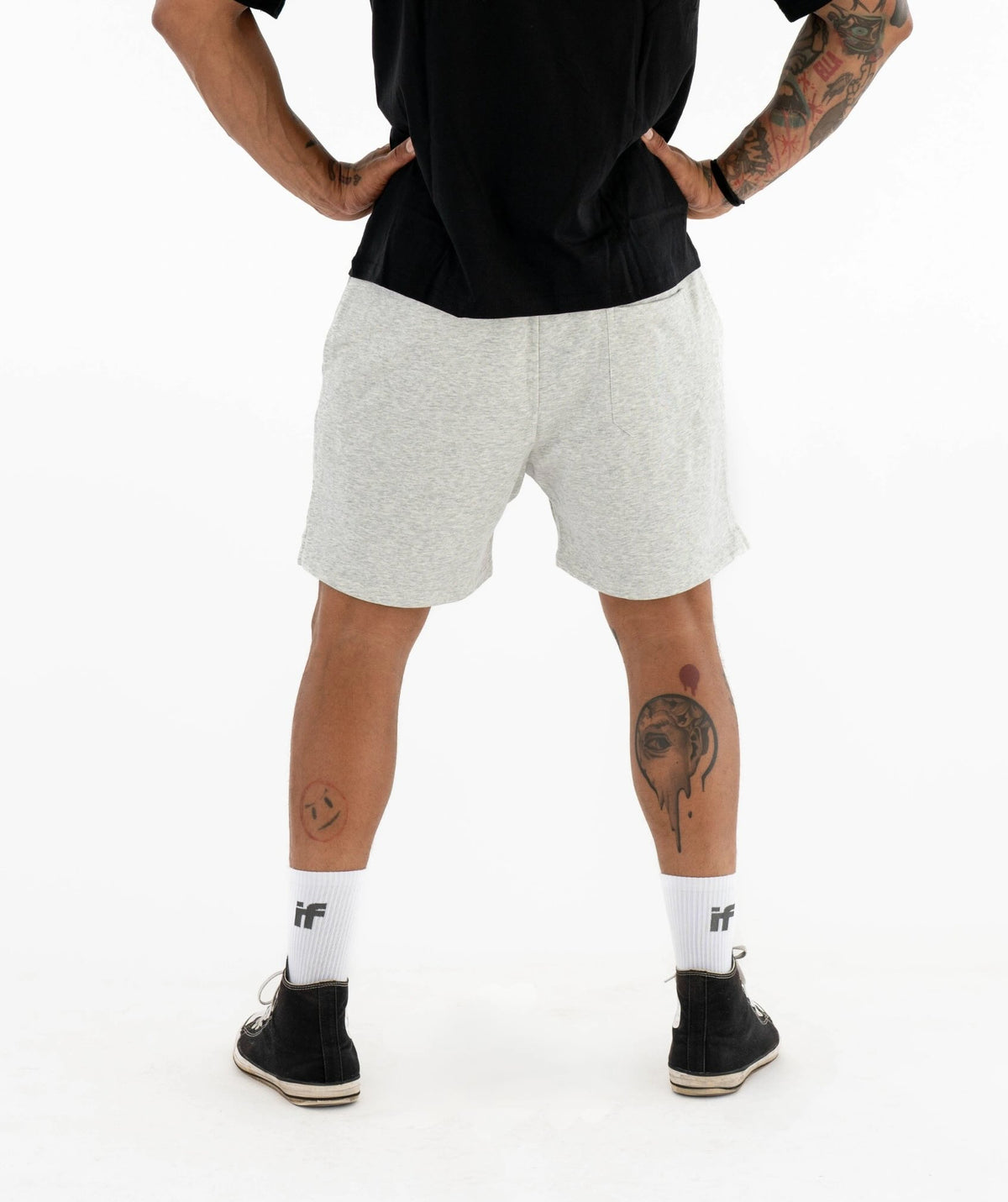 Person wearing gray shorts