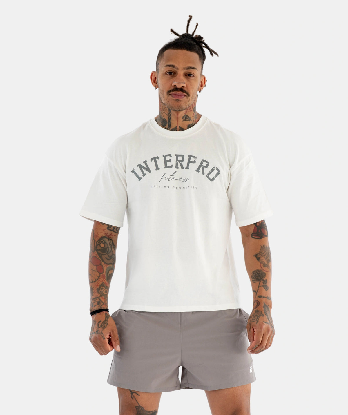 Man wearing a white 'Interpro' t-shirt 