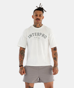Man wearing a white 'Interpro' t-shirt 