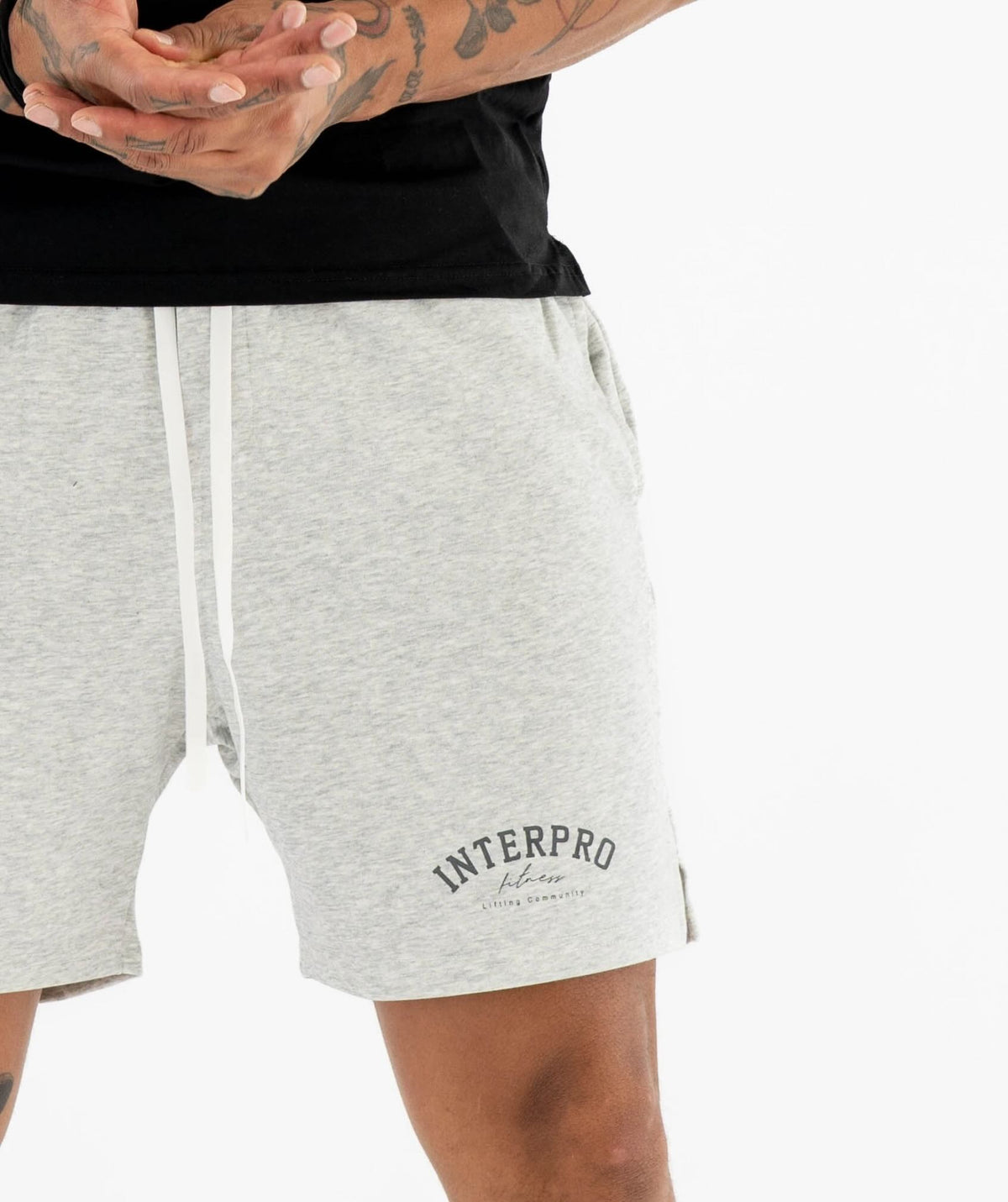 Person wearing Interpro gray shorts