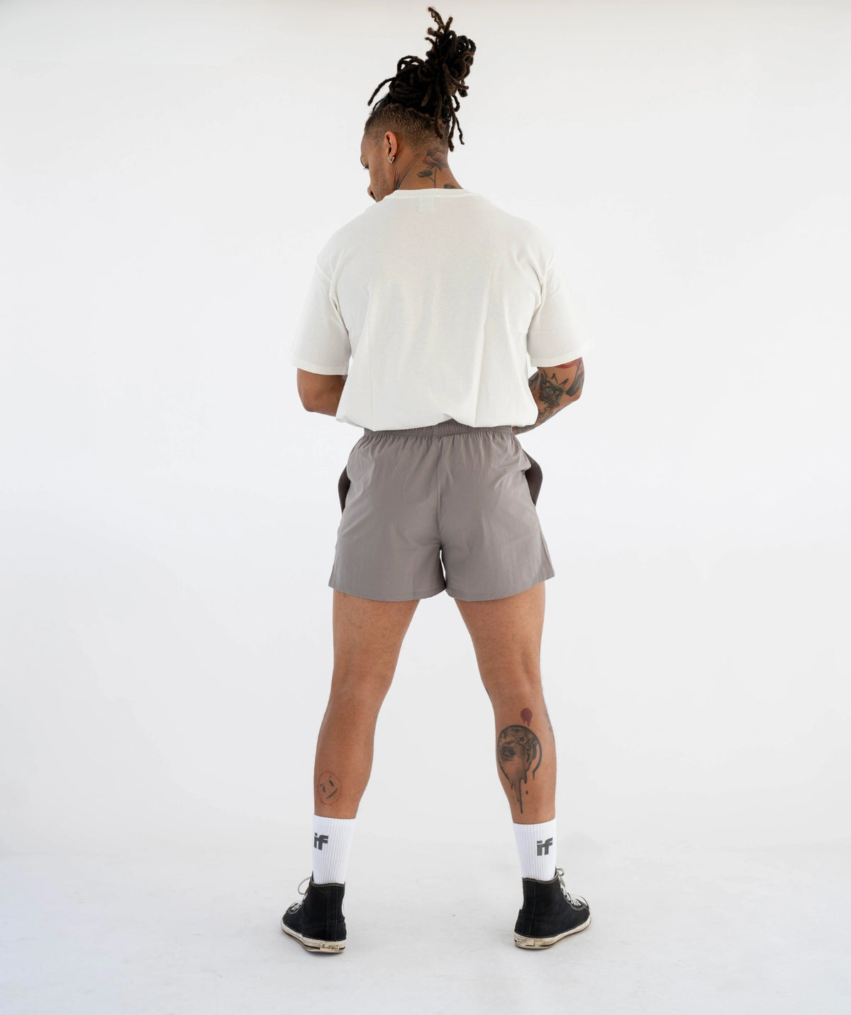 white t-shirt and gray shorts