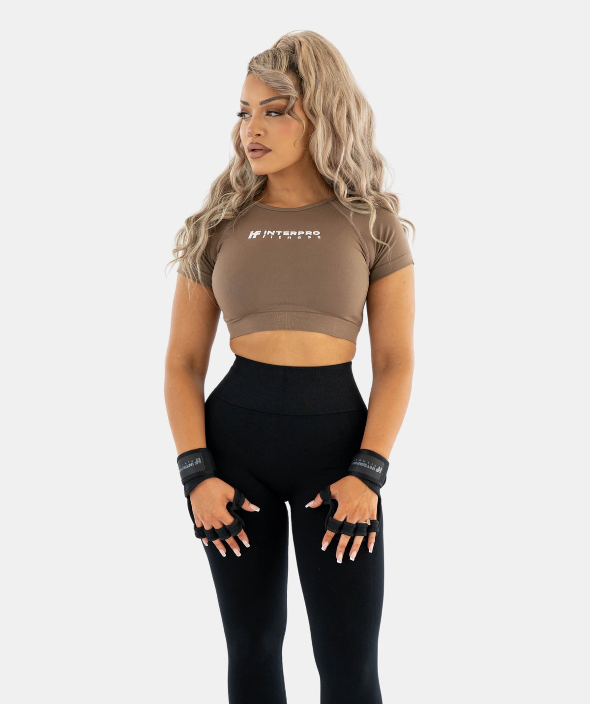 brown crop top and black leggings