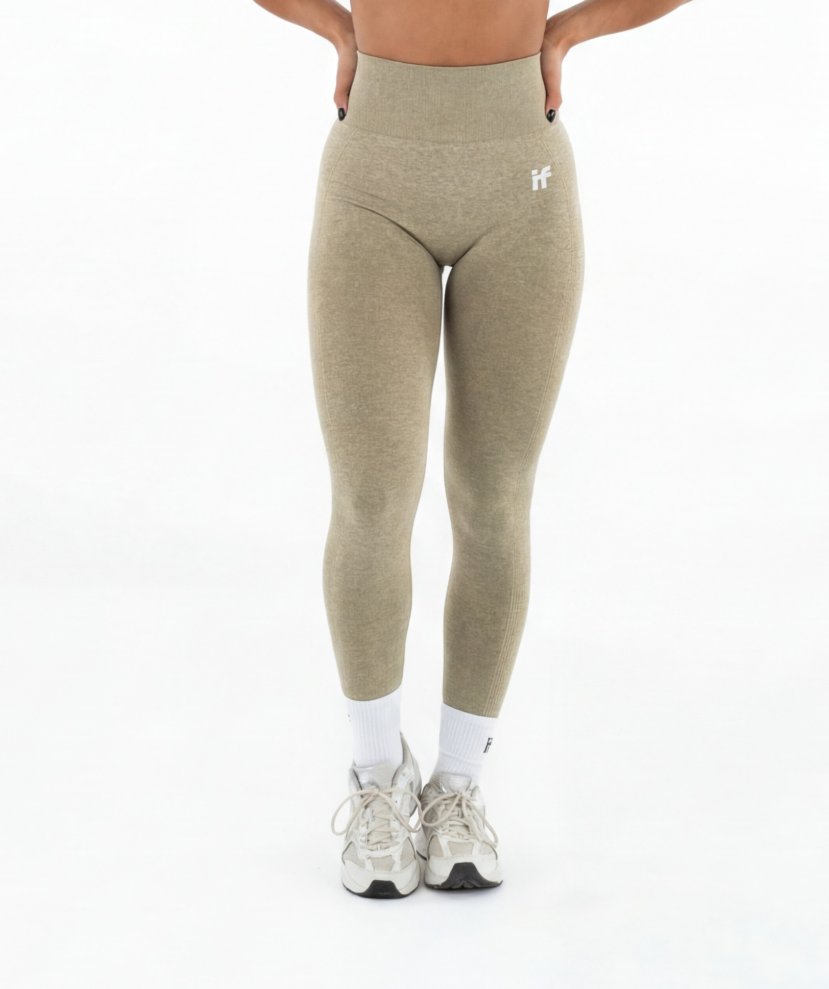 Green leggings worn by a person on a white background